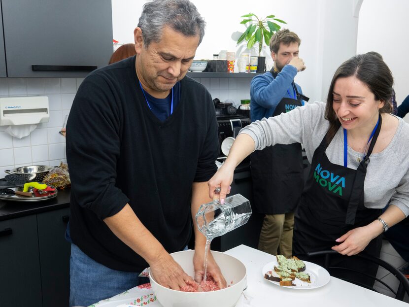 Tom Sanchez (left) cooks for a class assignment with a classmate in Kyiv, Ukraine, before...