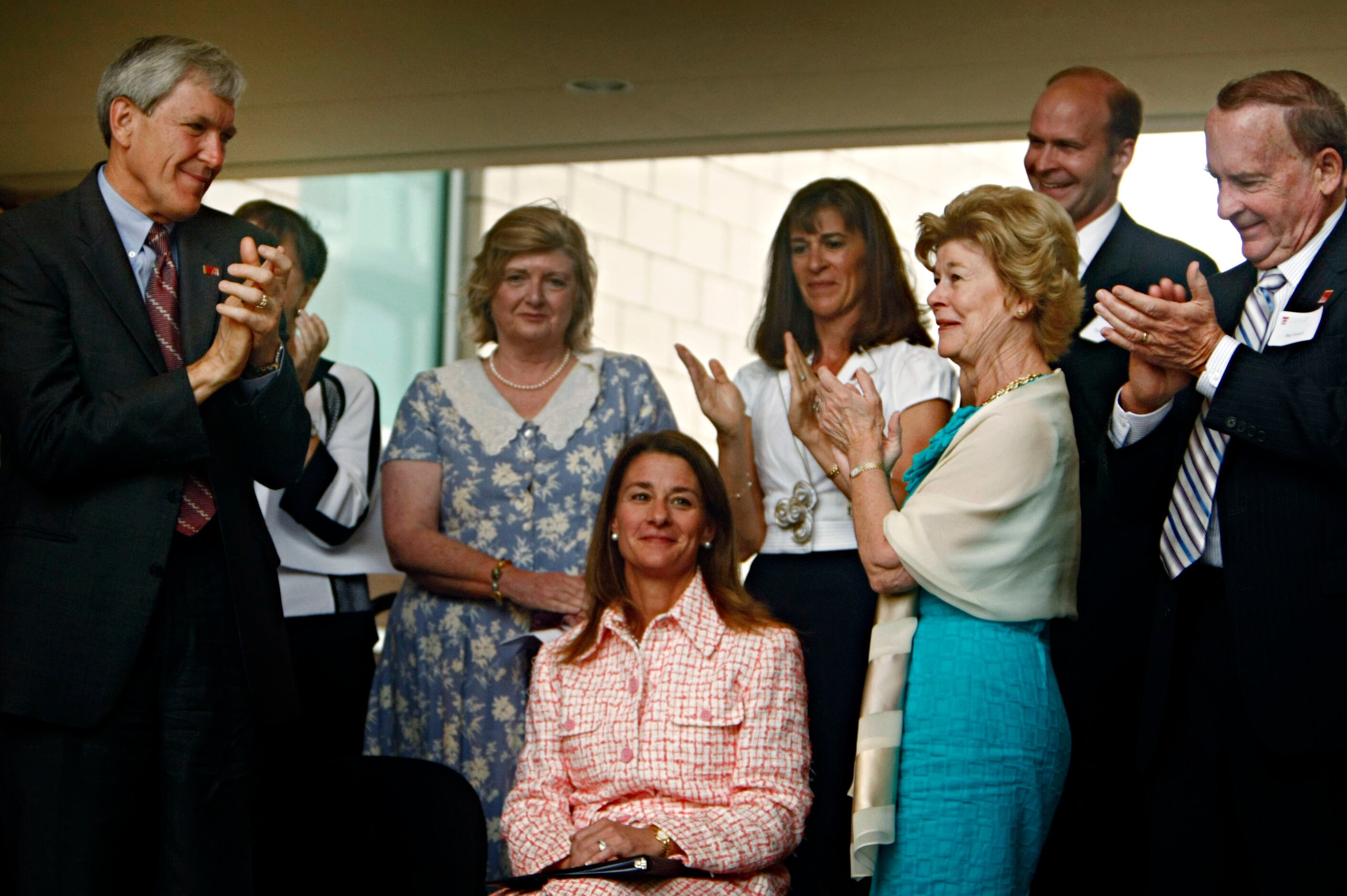 Melinda French Gates (center), co-chair of the Bill and Melinda Gates Foundation, receives a...