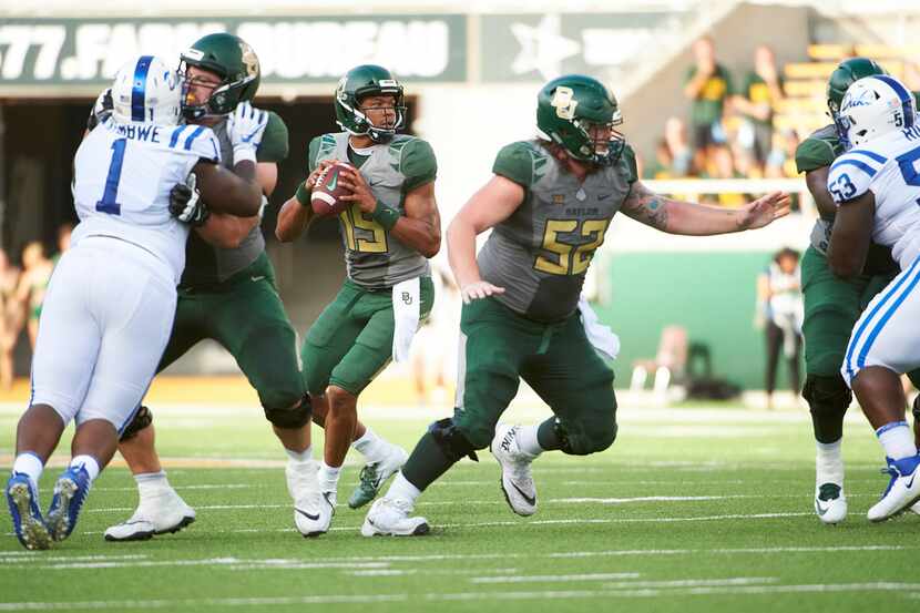 WACO, TX - SEPTEMBER 15:  Jalan McClendon #19 of the Baylor Bears drops back to pass against...