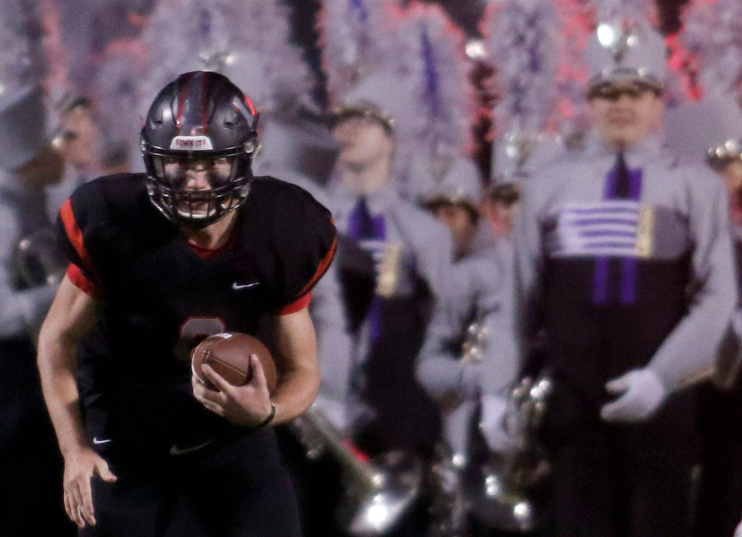 Lake Highlands quarterback Mitch Coulson (6) rushes for a first down during the second...