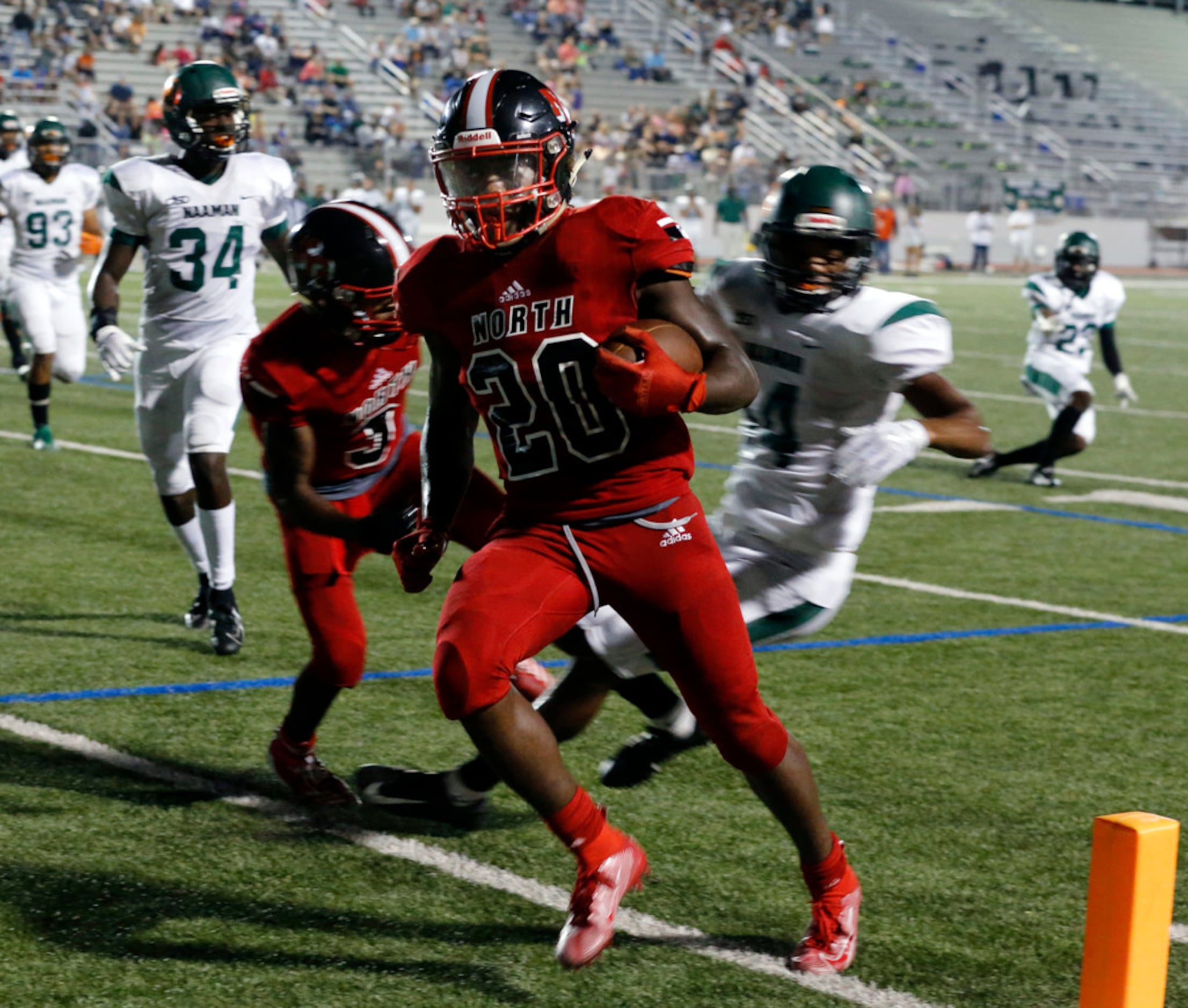 North Garland RB Sabron Woods (20) runs into the end zone for a touchdown during the first...