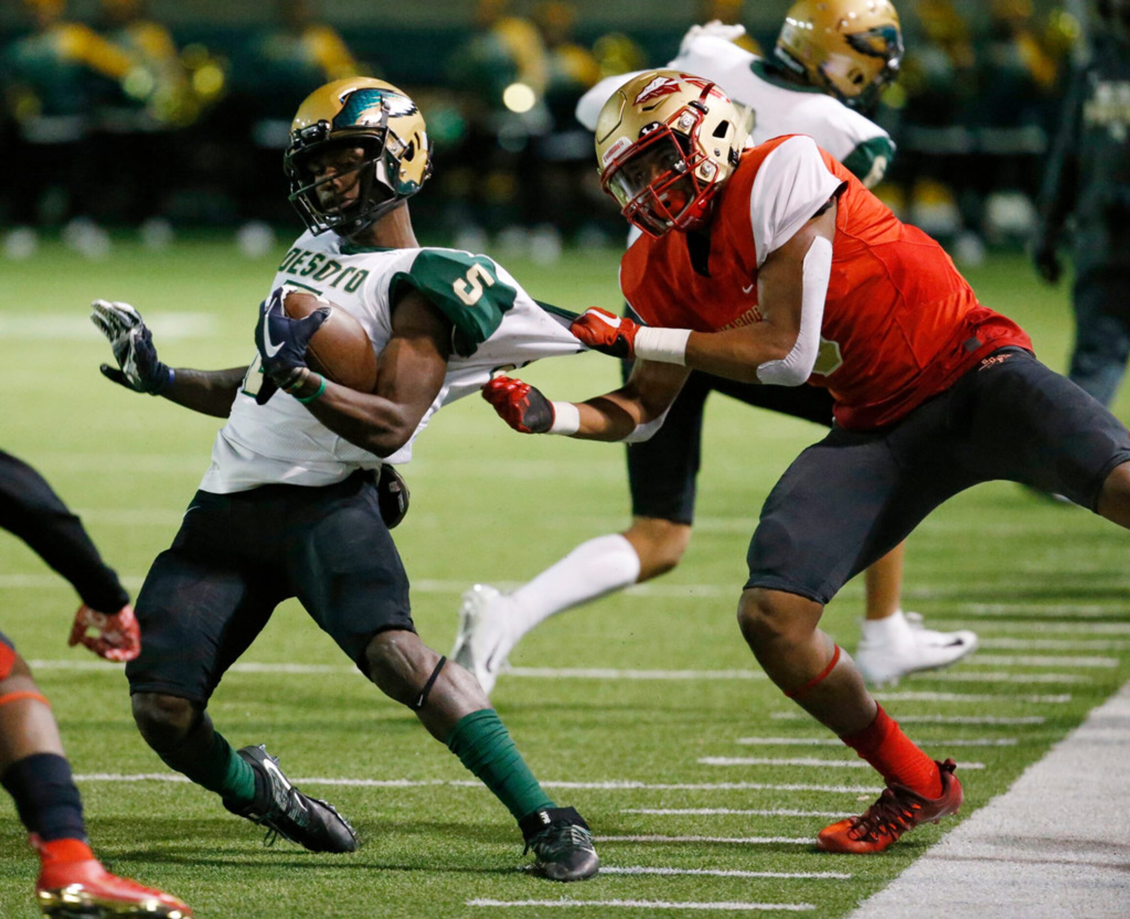 South Grand Prairie's Mules Jernigan stops DeSoto's Tyson Alexander during the first half of...