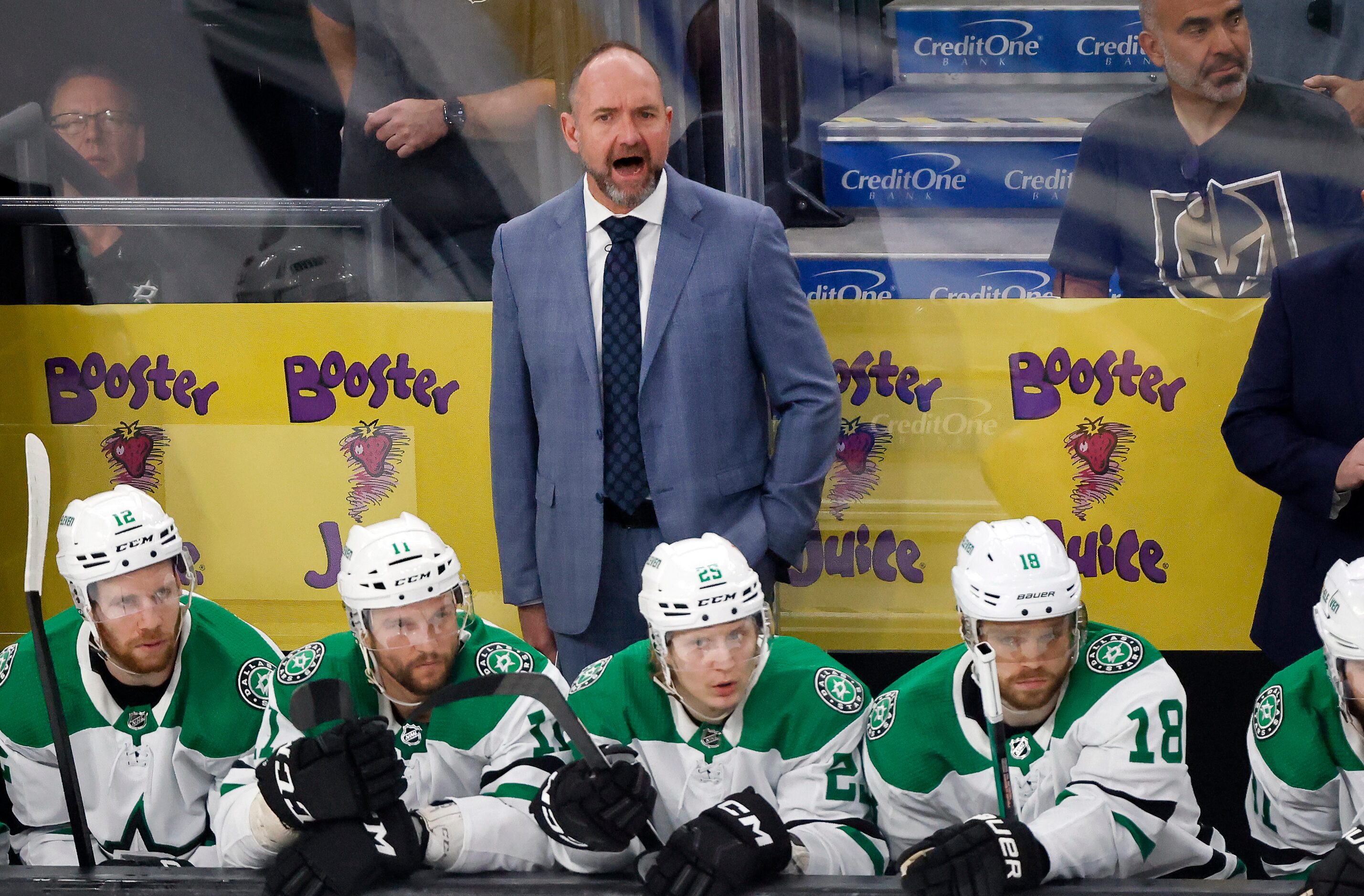 Dallas Stars head coach Peter DeBoer yells instruction to his players during the first...