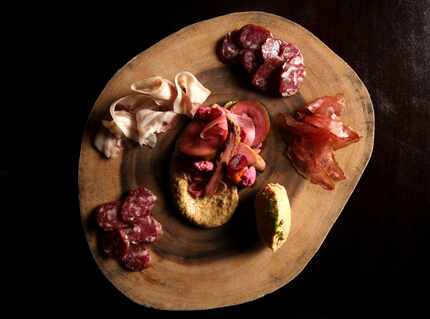 Even the charcuterie board (pictured) matches the elegance of the Mansion Bar.
