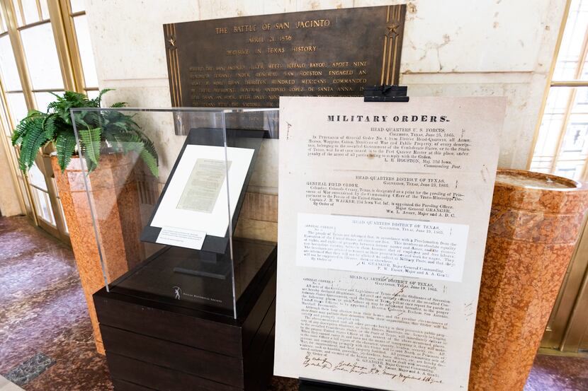 An enlarged photo copy of General Gordon Granger's announcement that slaves were freed, two...