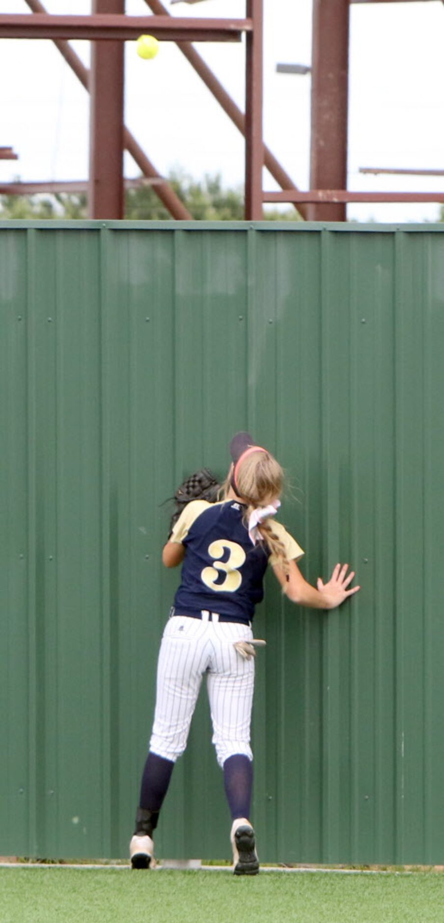 Keller center fielder Mikayla McClasky (3) helplessly watches as Lewisville infielder...