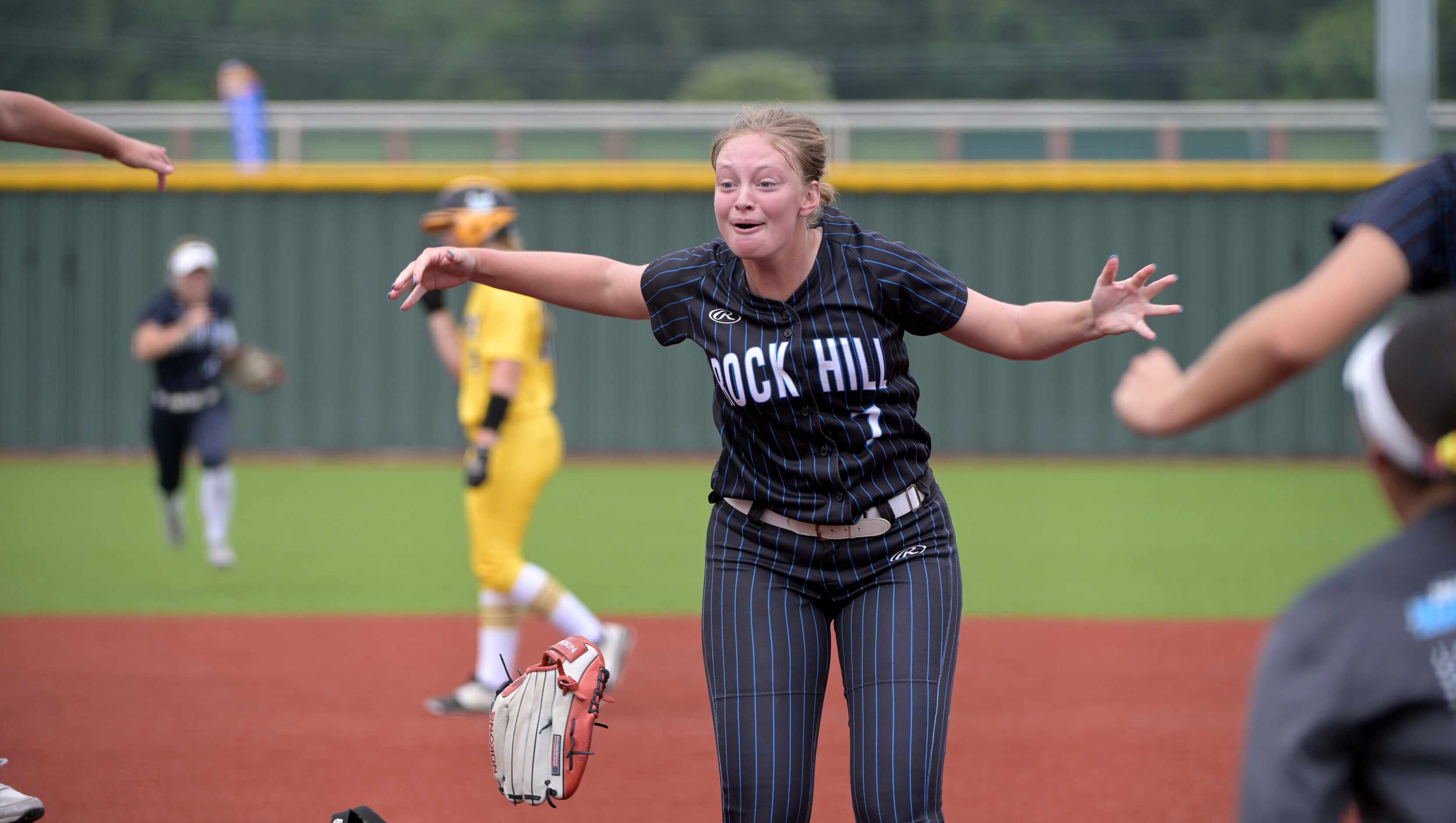 Prosper Rock Hill’s Grace Berlage (7) celebrates after getting a stikeout to end game 3 of a...