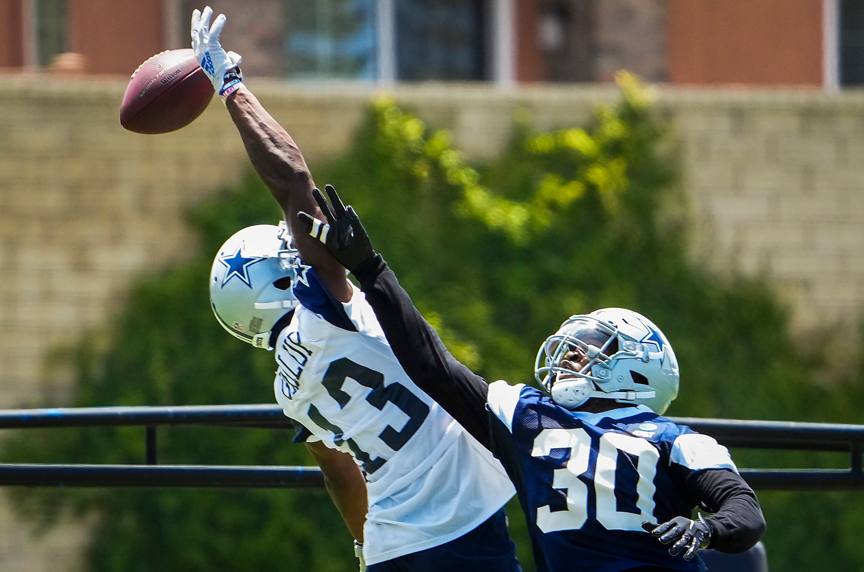 Dallas Cowboys cornerback Anthony Brown (30) breaks up a pass intended for wide receiver...