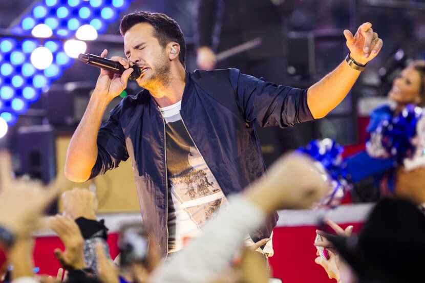 Luke Bryan performs during the half time show of the Dallas Cowboys v. Caroline Panthers...