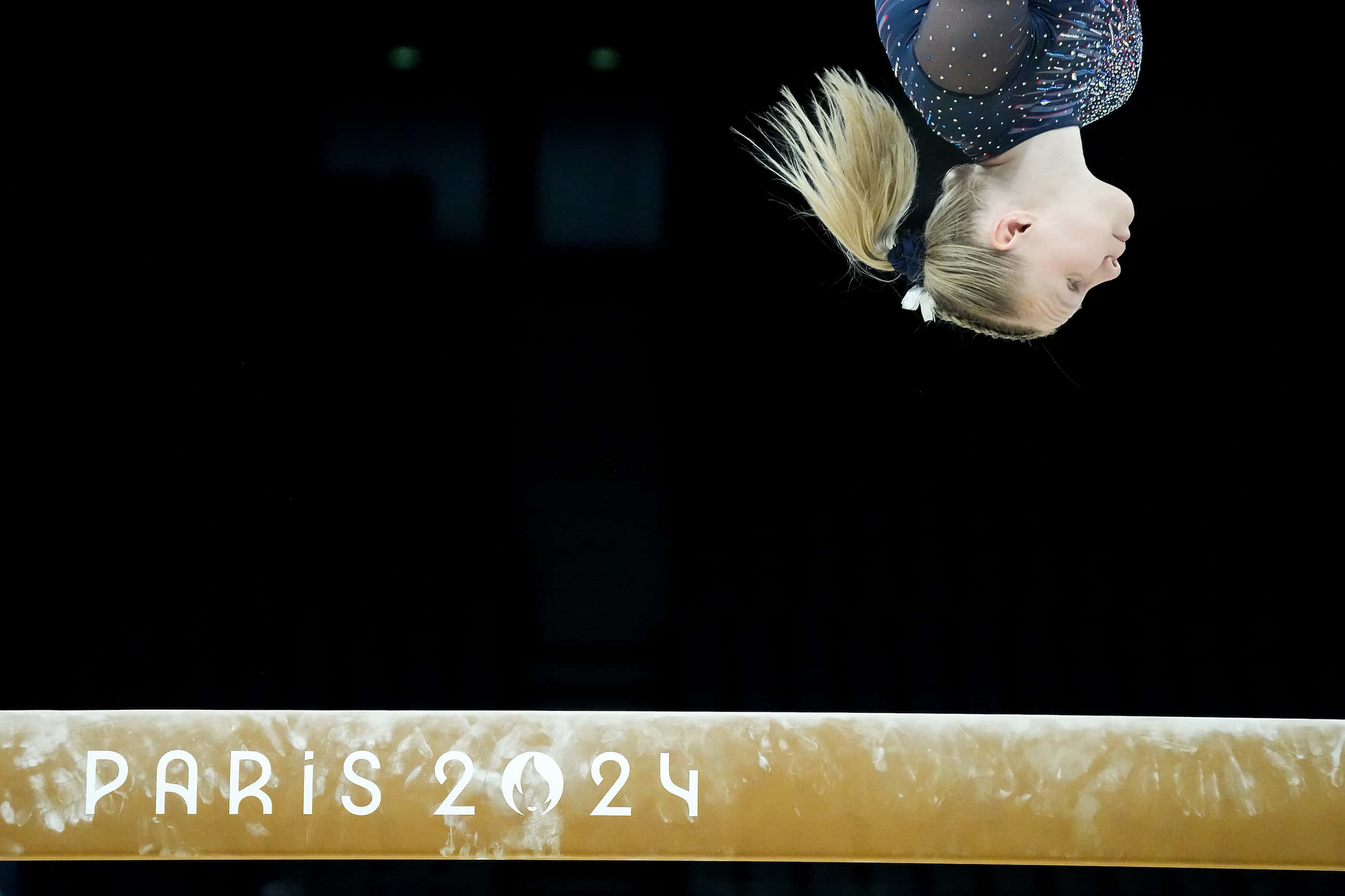 Jade Carey of the United States practices on the balance beam during women’s gymnastics...
