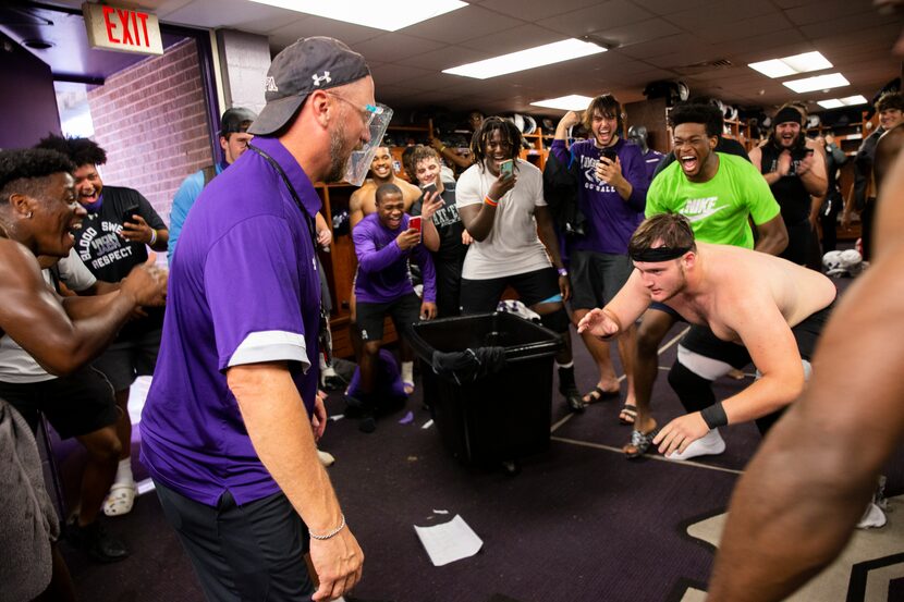 Stephen F. Austin Lumberjacks players cheer on as coach Colby Carthel jokes about wrestling...