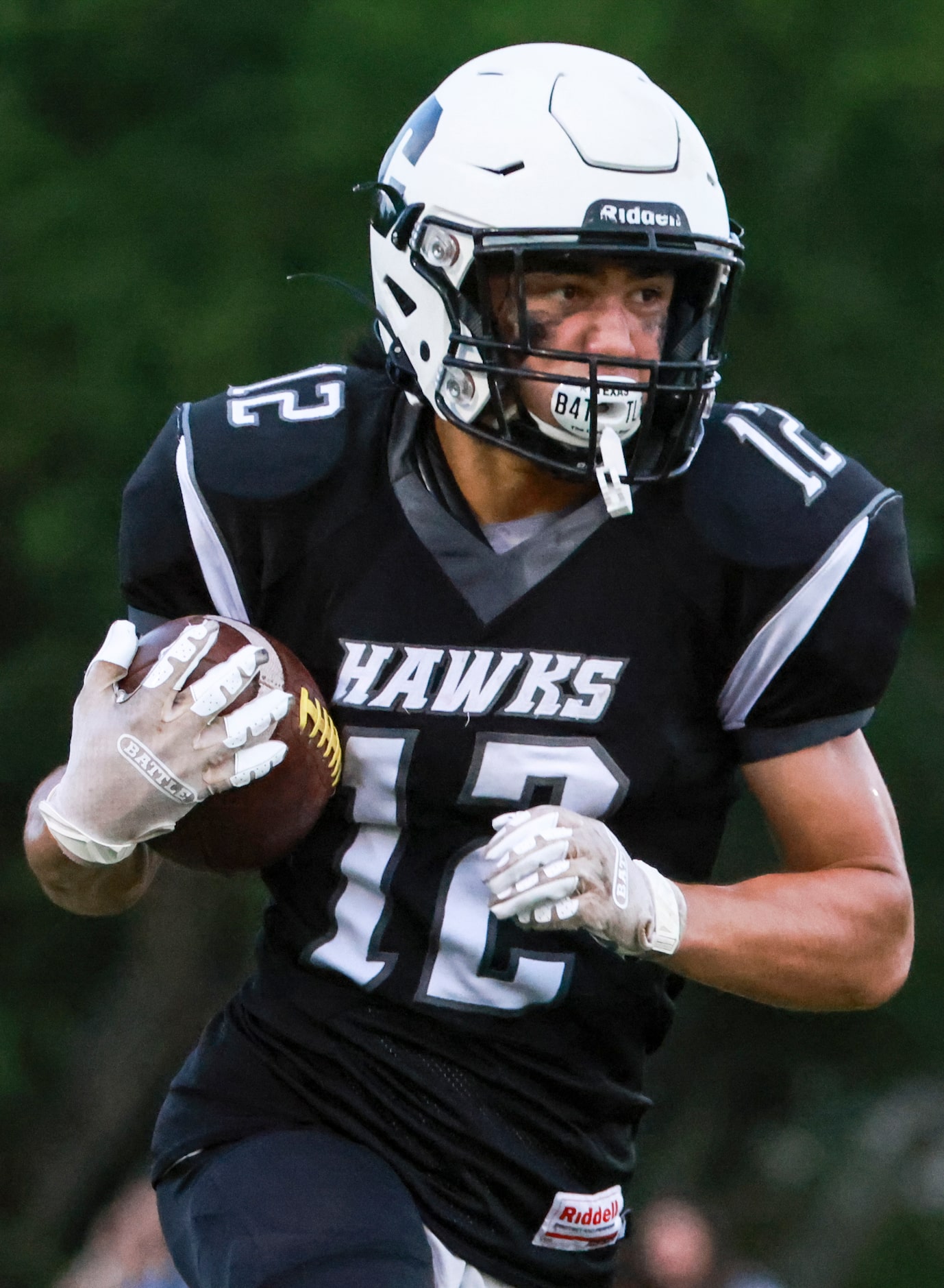 Cistercian Preparatory School JP Roppolo (12) runs the ball up the field during the football...