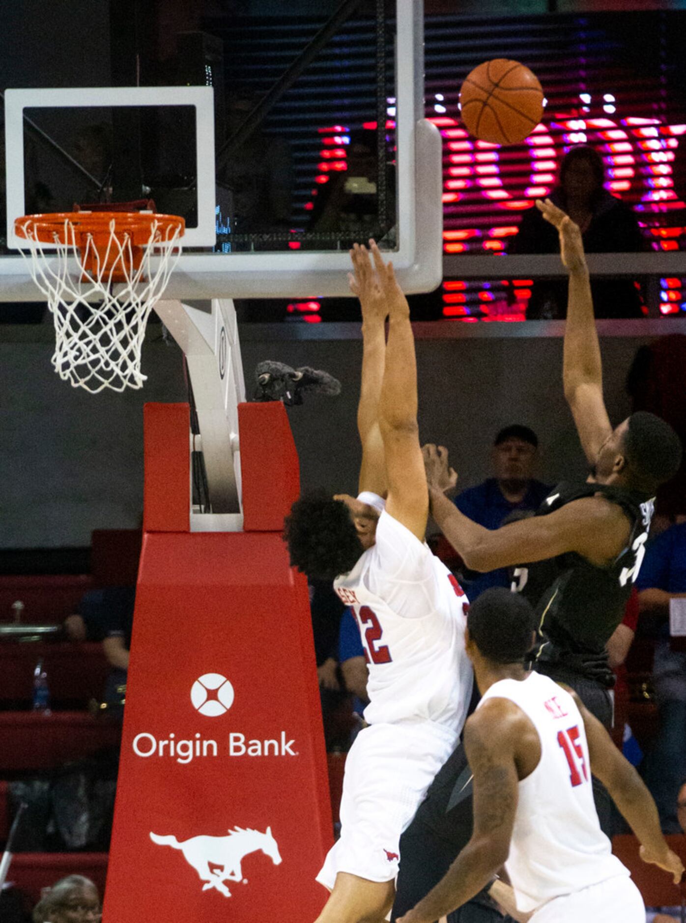 Southern Methodist Mustangs guard Darius McNeill (2) jumps to block a shot by UCF Knights...