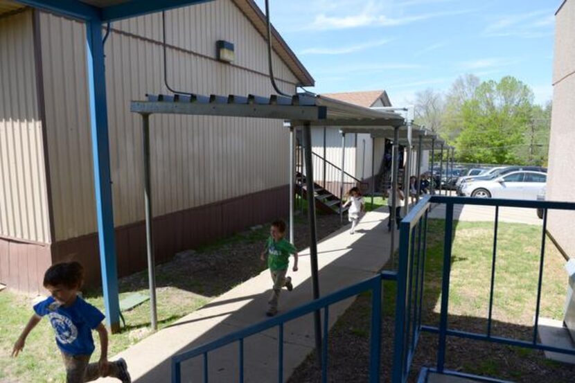 
Students exit class from the portables outside Lakewood Elementary in Dallas. A group of...