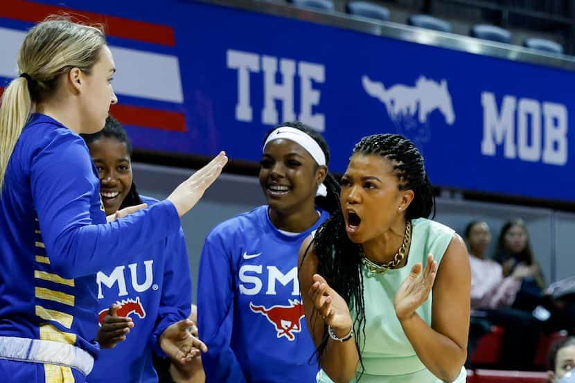 SMU head coach Toyelle Wilson cheers on the team during the first half of a game against...