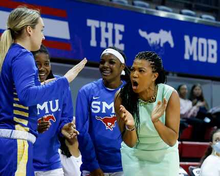 SMU head coach Toyelle Wilson cheers on the team during the first half of a game against...