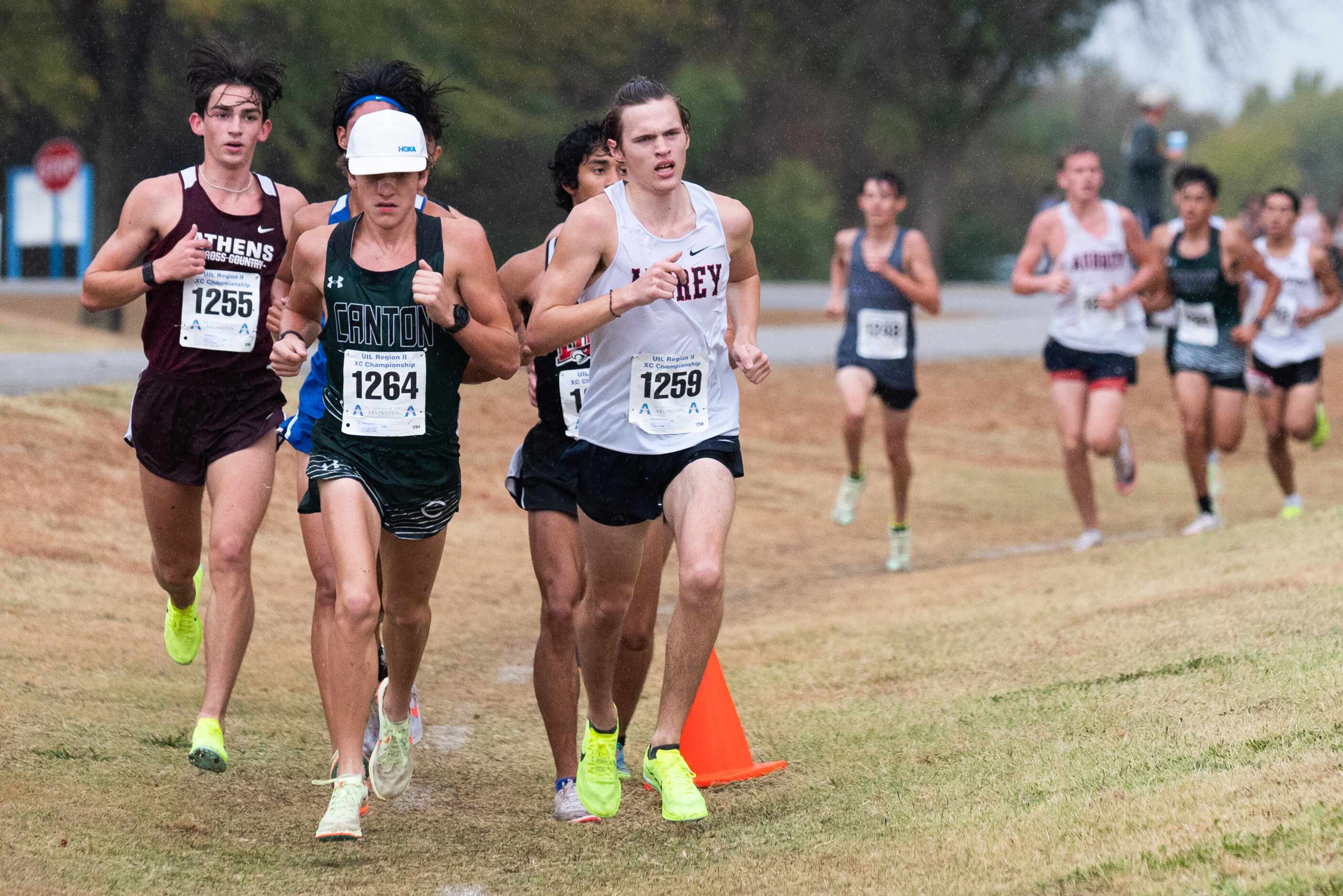 Canton runner Miguel Arce, left, and Aubrey Brayden Murphy, right, lead a pack of runners...
