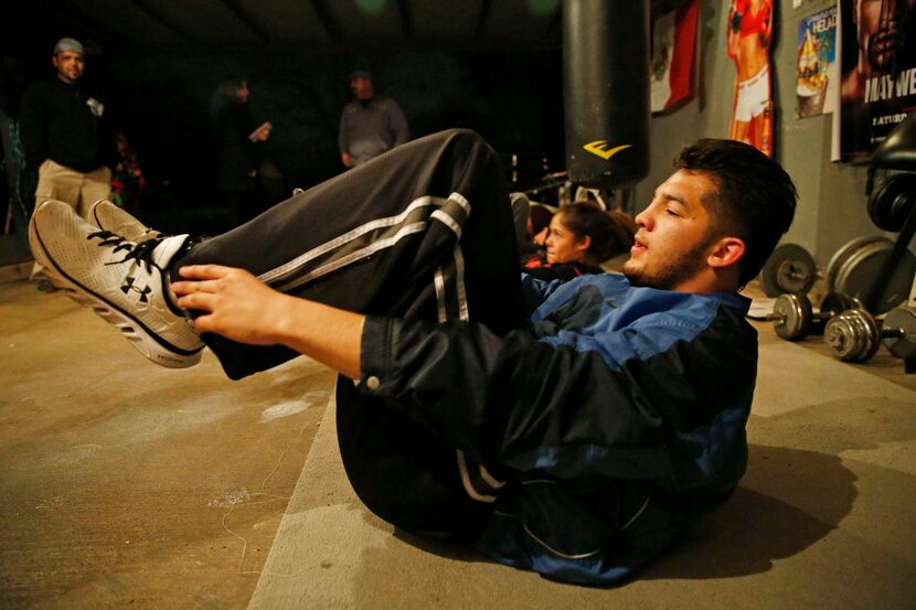 Rafael  trains with other young boxers at the Alacranes Boxing Club, a gym run by his...