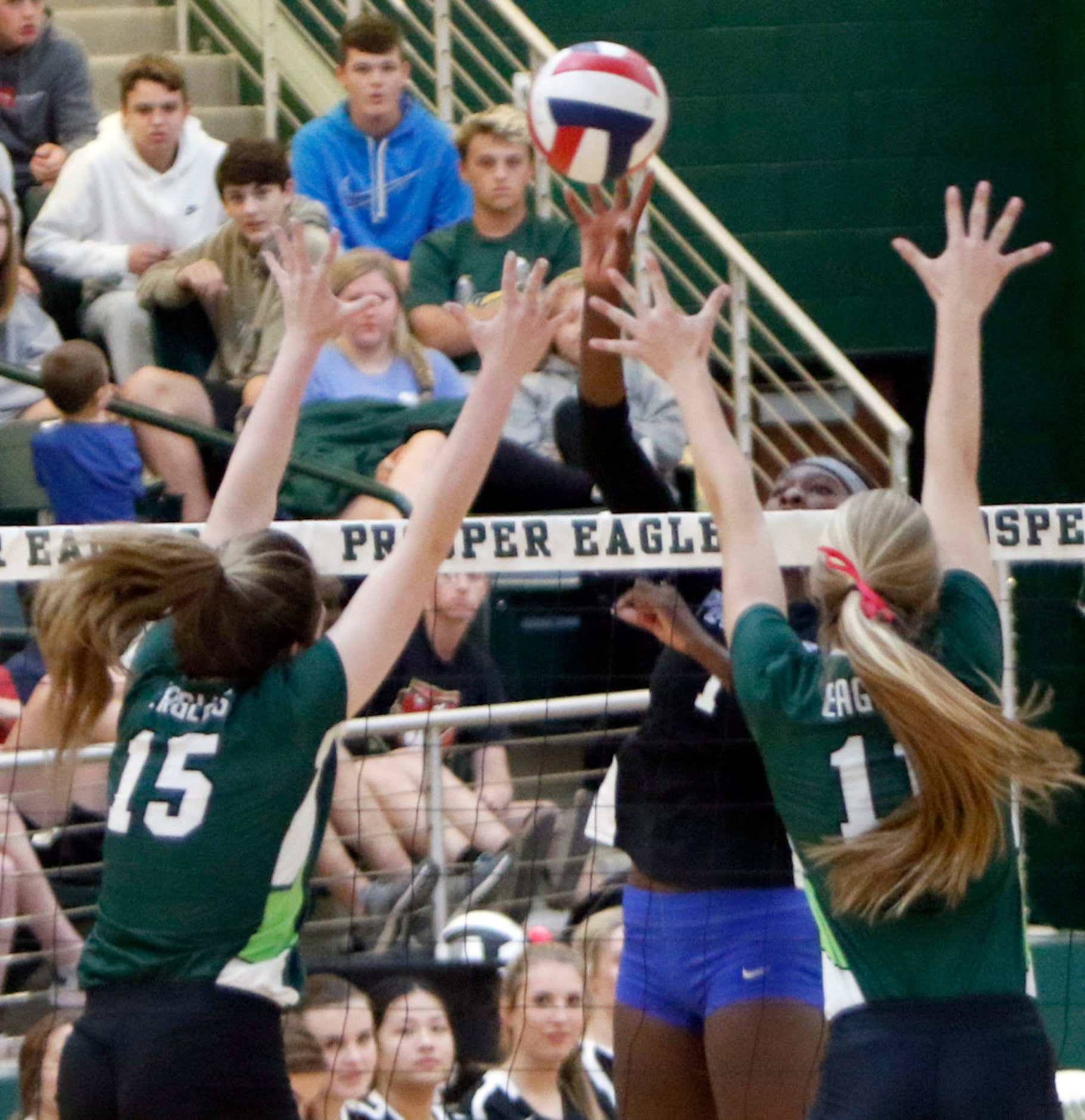 Iman Ndiaye (1), from Plano West, powers a shot past Prosper defenders Nikki Steinheiser...