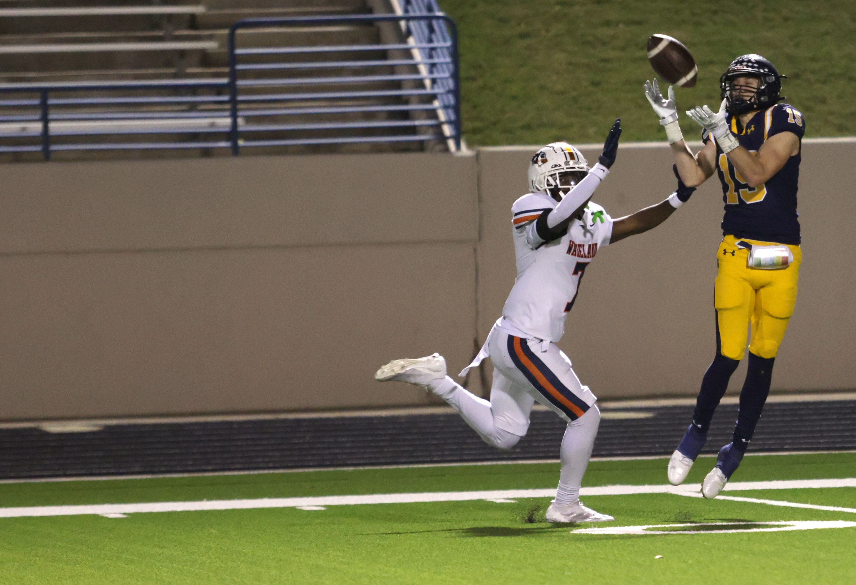 Highland Park's Benton Owens (15) attempts to catch a deep pass with Frisco Wakeland's...