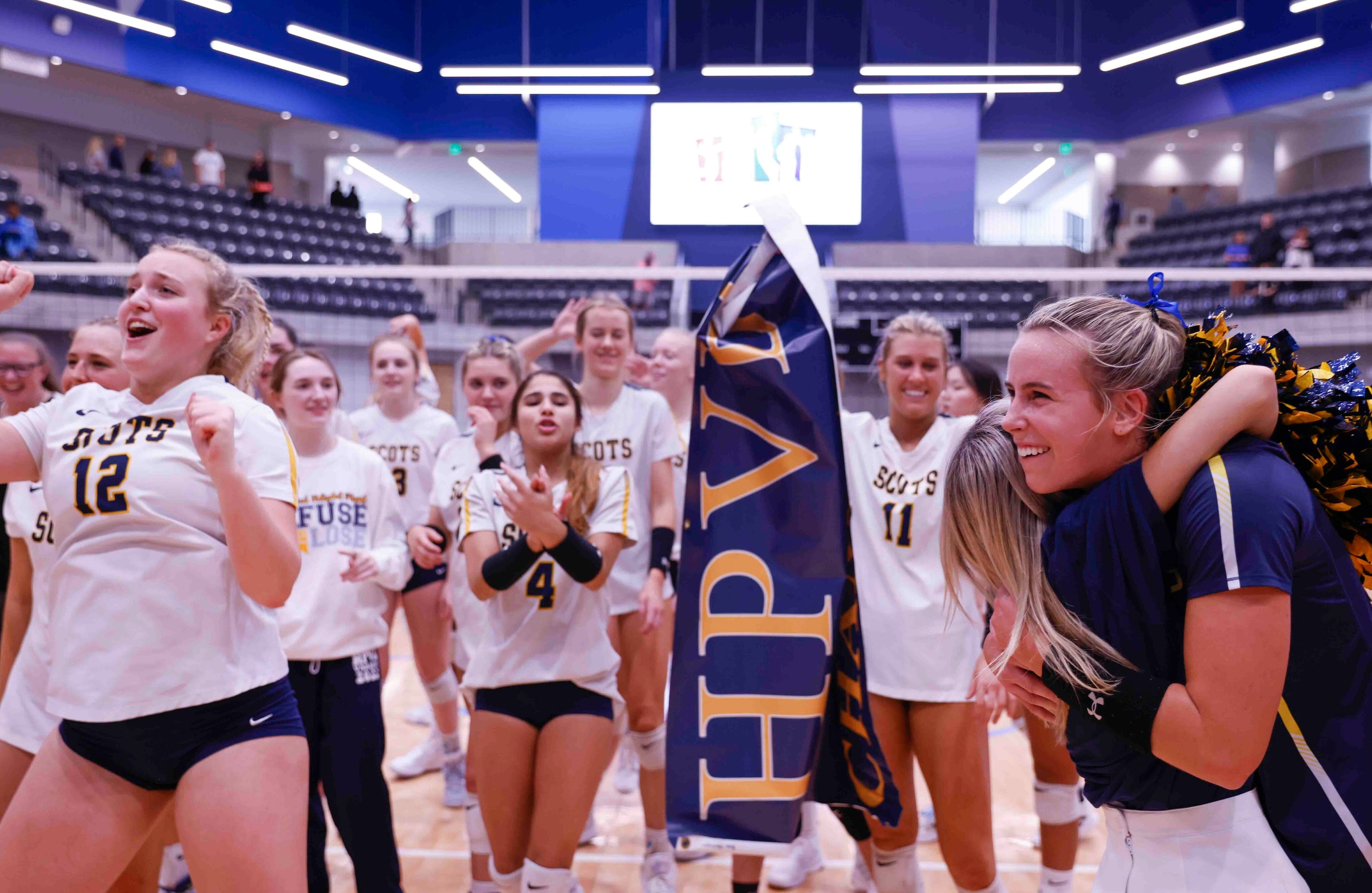 Highland Park players celebrate after winning against Flower Mound during a volleyball game...