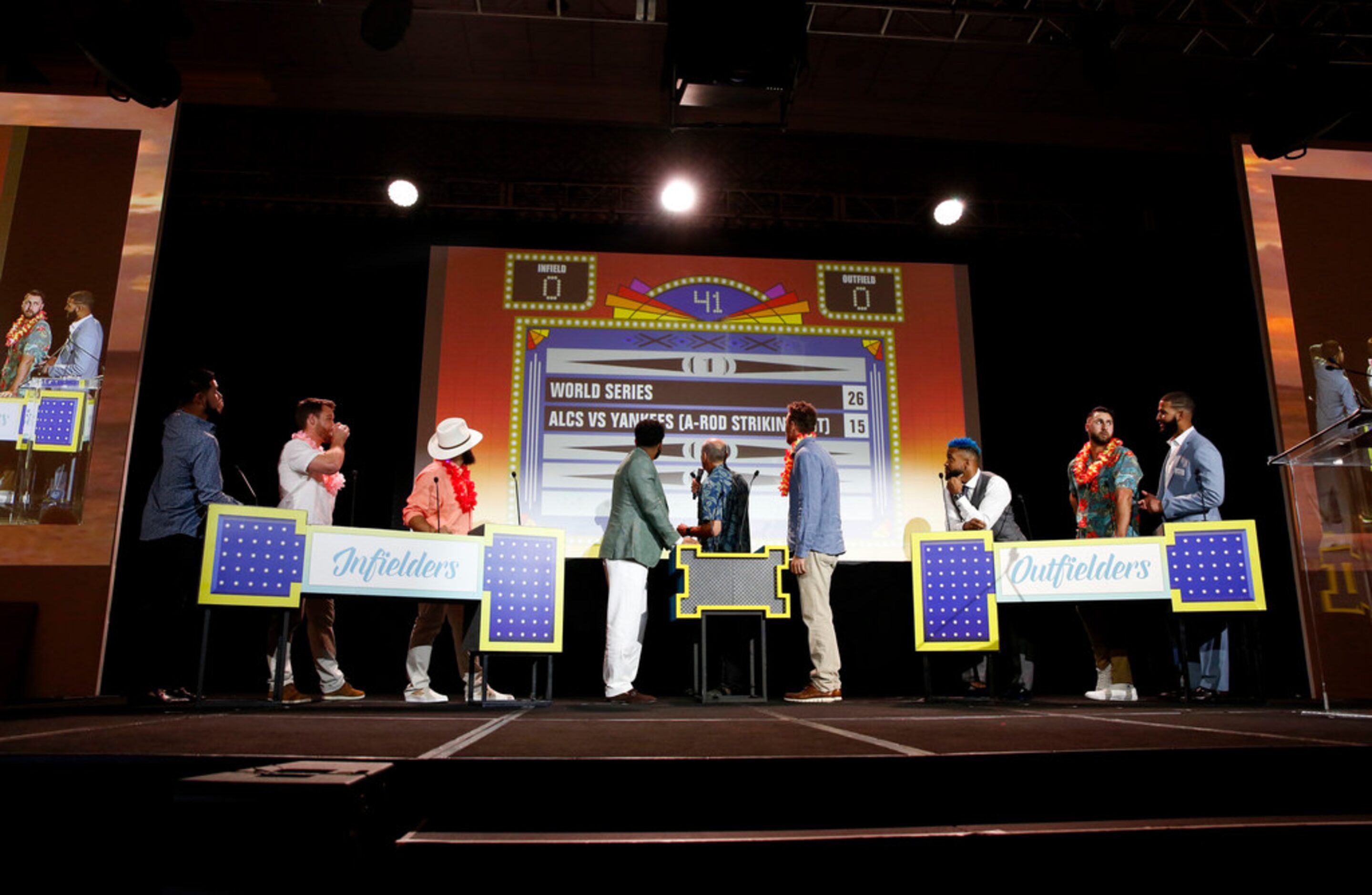 Texas Rangers players play "Fielders Feud" with announcer Eric Nadel (center) at the annual...