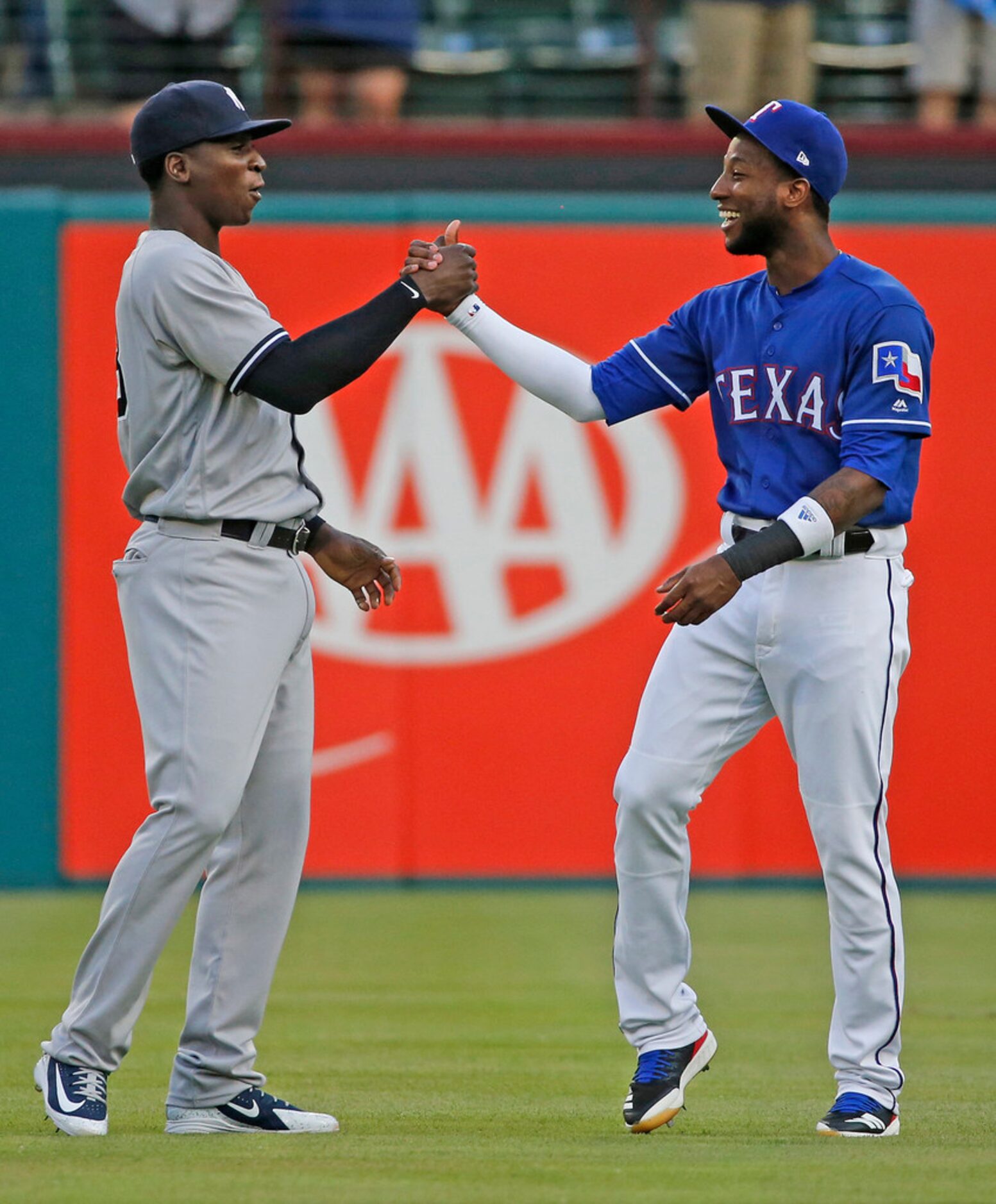 New York Yankees shortstop Didi Gregorius (18) and Texas Rangers shortstop Jurickson Profar...