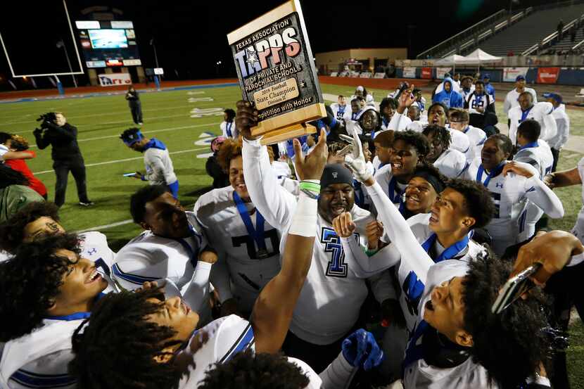 TC-Cedar Hill coach Andre' Hart celebrates with his team after beating Austin Regents 48-19...