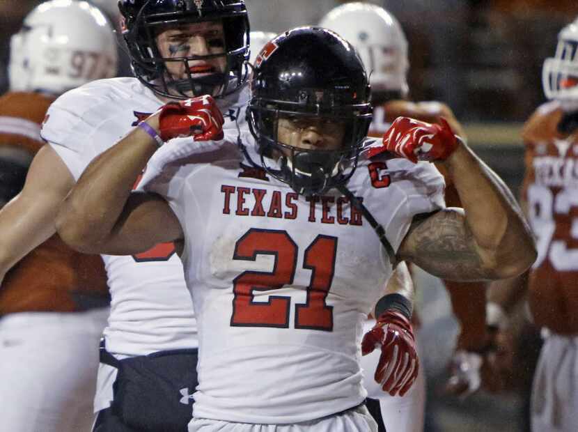 Texas Tech's DeAndre Washington (21) celebrates his touchdown during the second half of an...