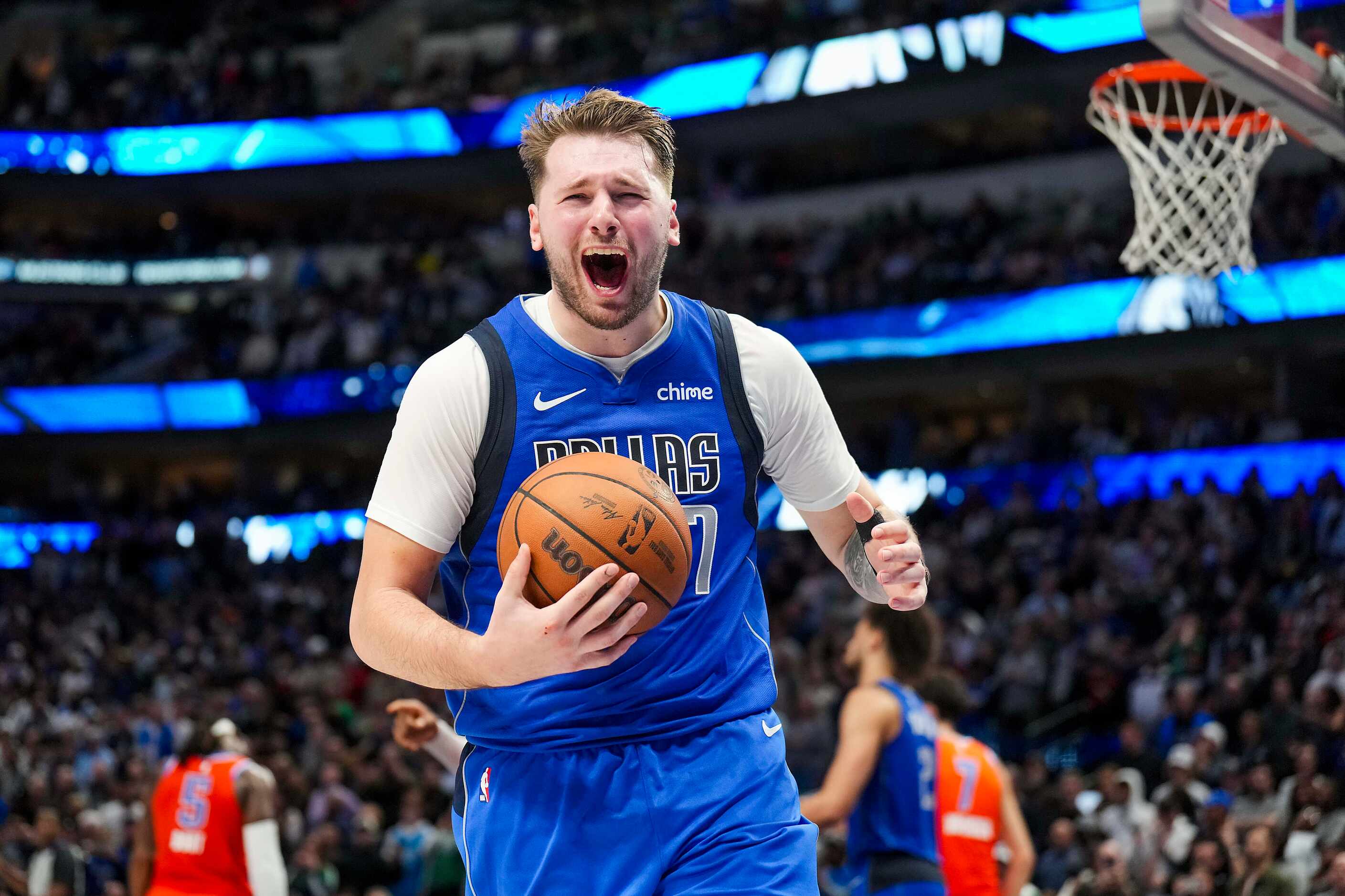 Dallas Mavericks guard Luka Doncic reacts after being called for traveling with 1:27 left in...
