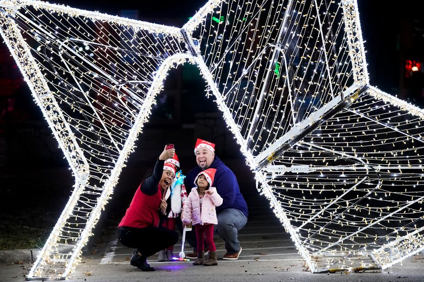 Erica Gonzalez takes a selfie with her husband Sergio and daughters Gianna, 4, and ...