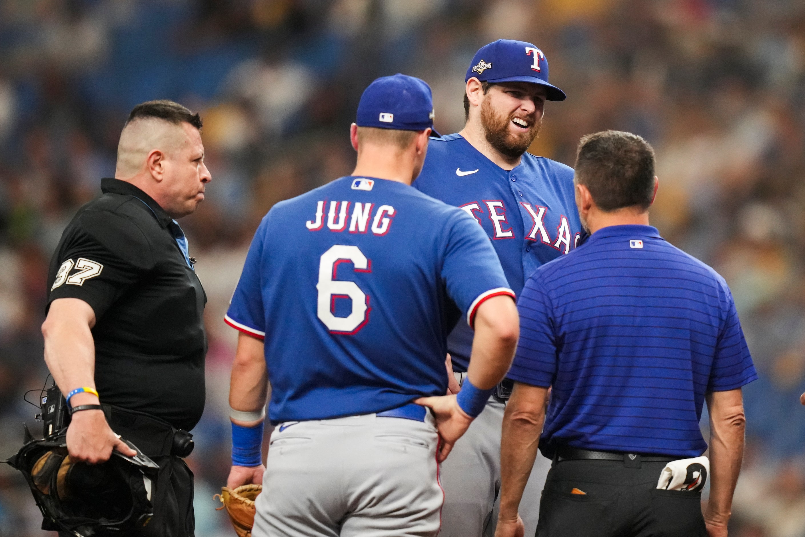 Texas Rangers starting pitcher Jordan Montgomery receives a mound visit after making a...