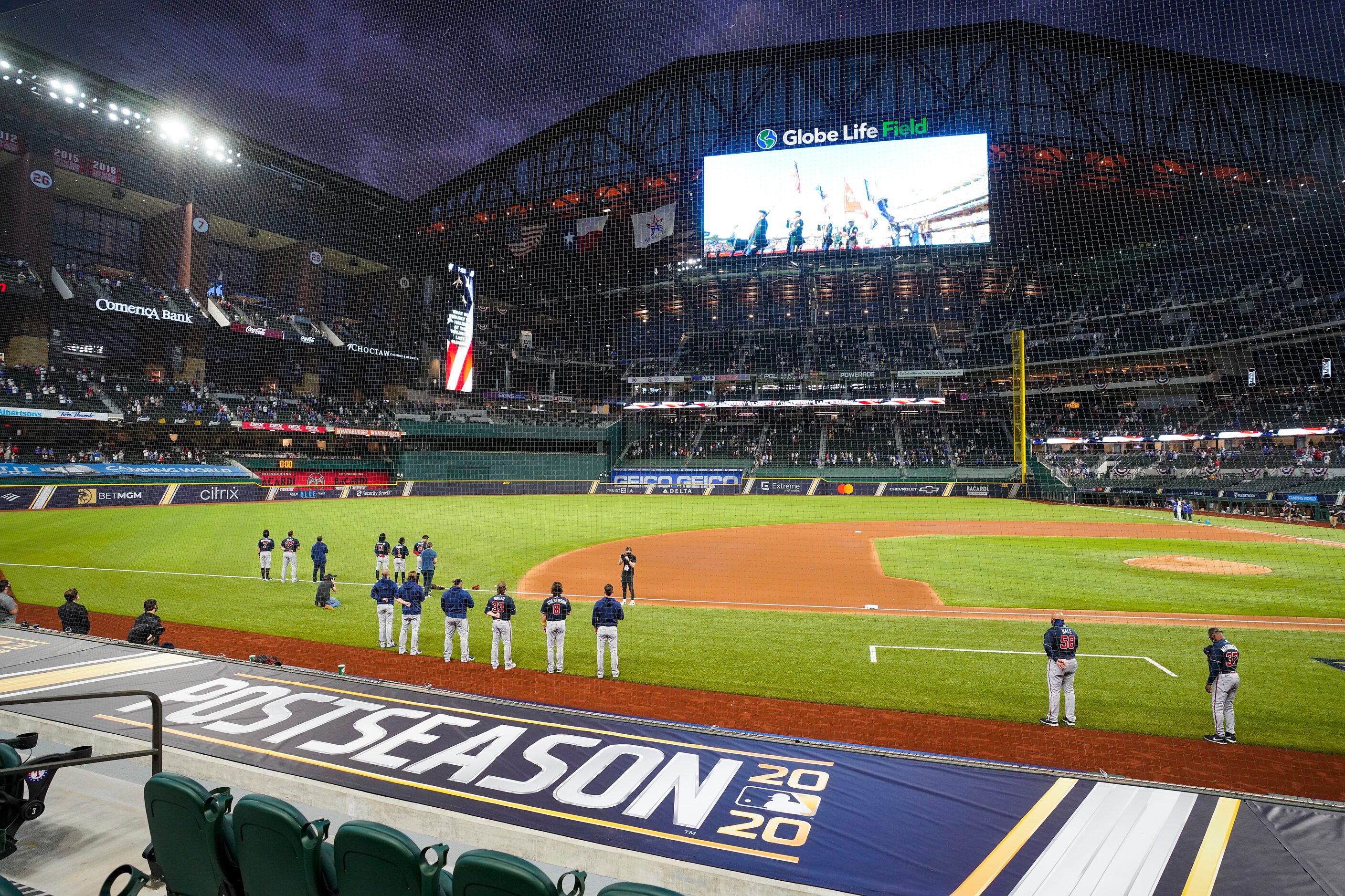 Player stand for the national anthem before Game 7 of a National League Championship Series...