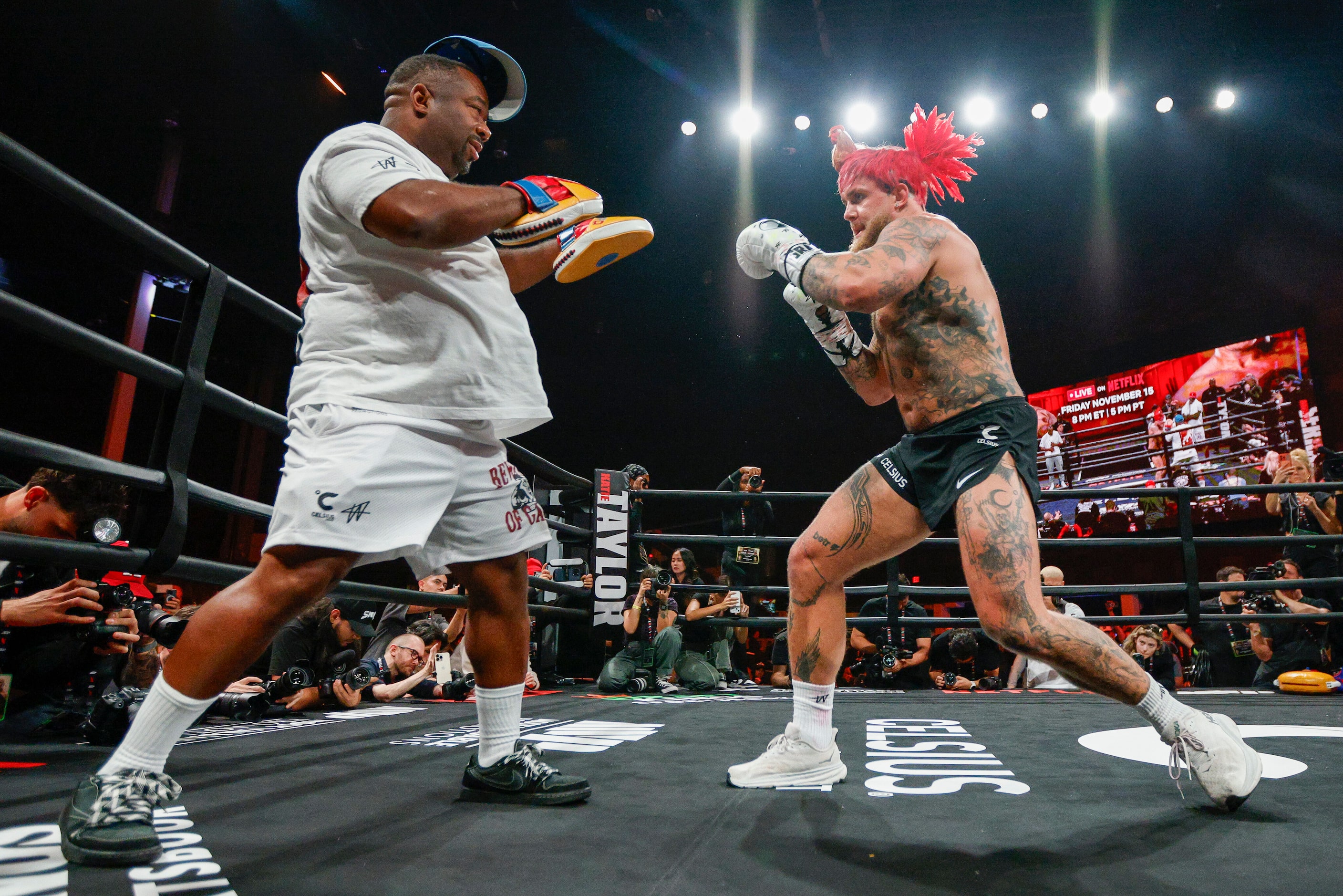 Jake Paul spars with a coach during an open workout ahead of his upcoming boxing bout...