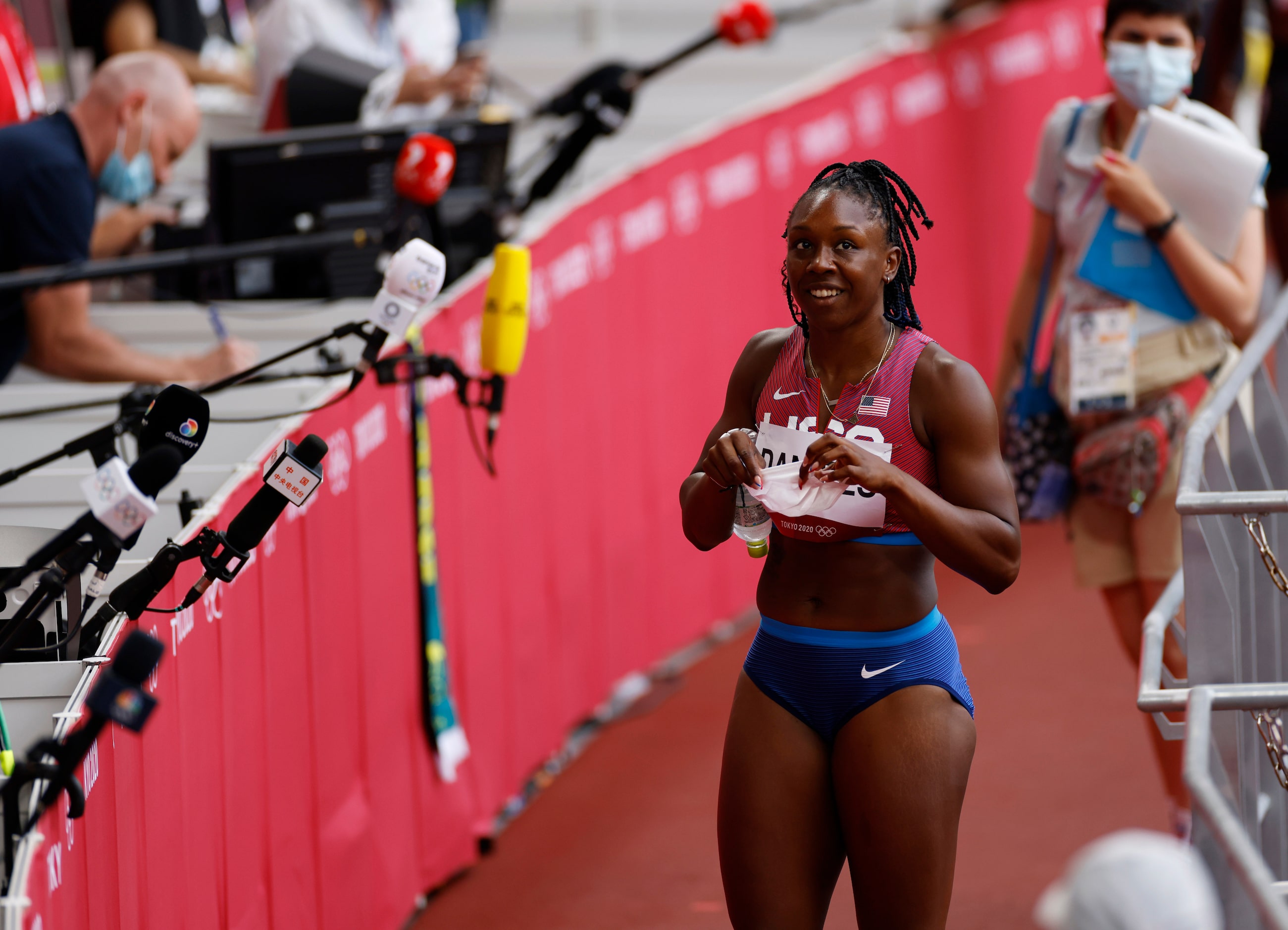 USA’s Teahna Daniels smiles before answering questions from the media after competing in a...