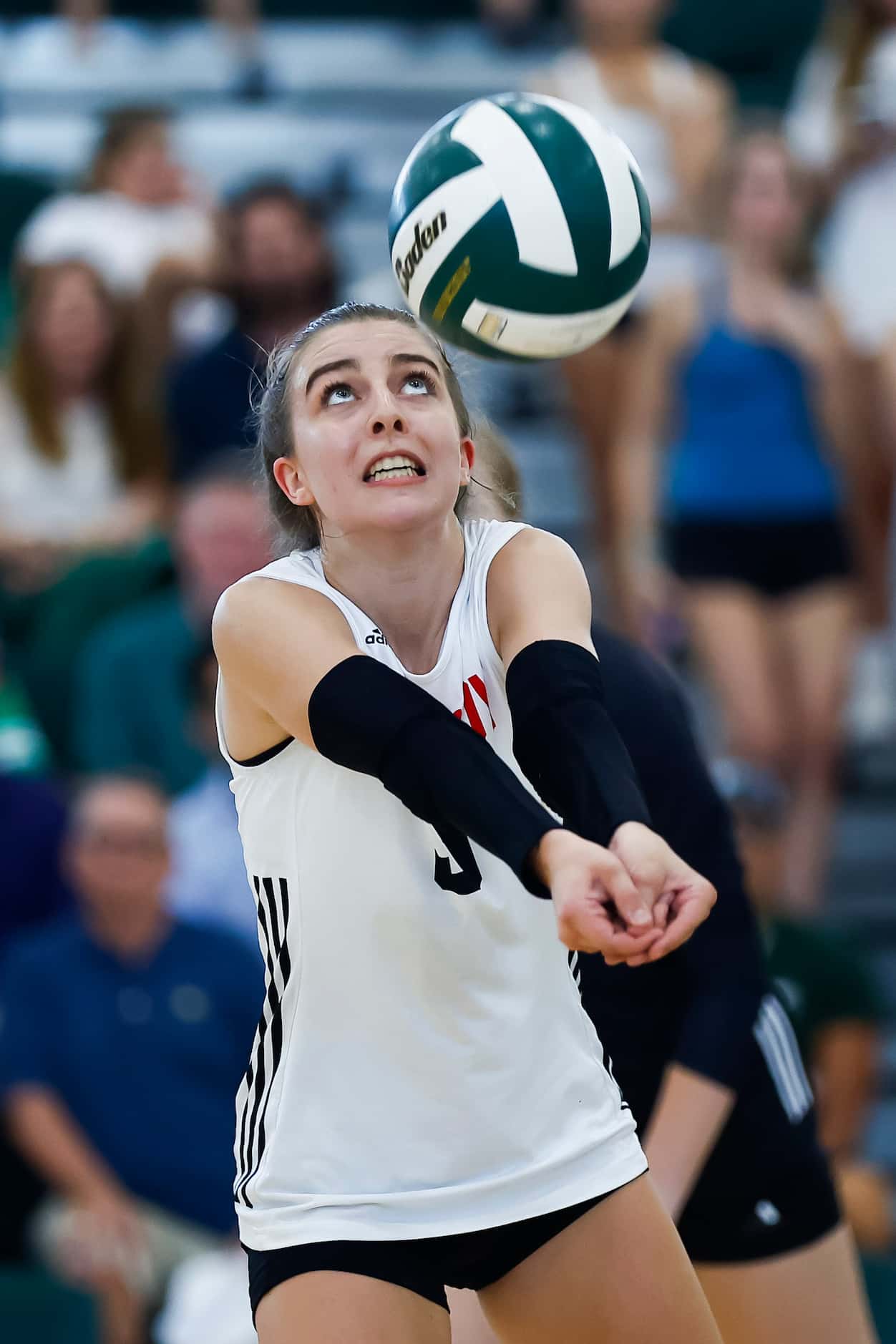 Love Joy senior libero McKenna Brand digs the ball during a high school volleyball match...