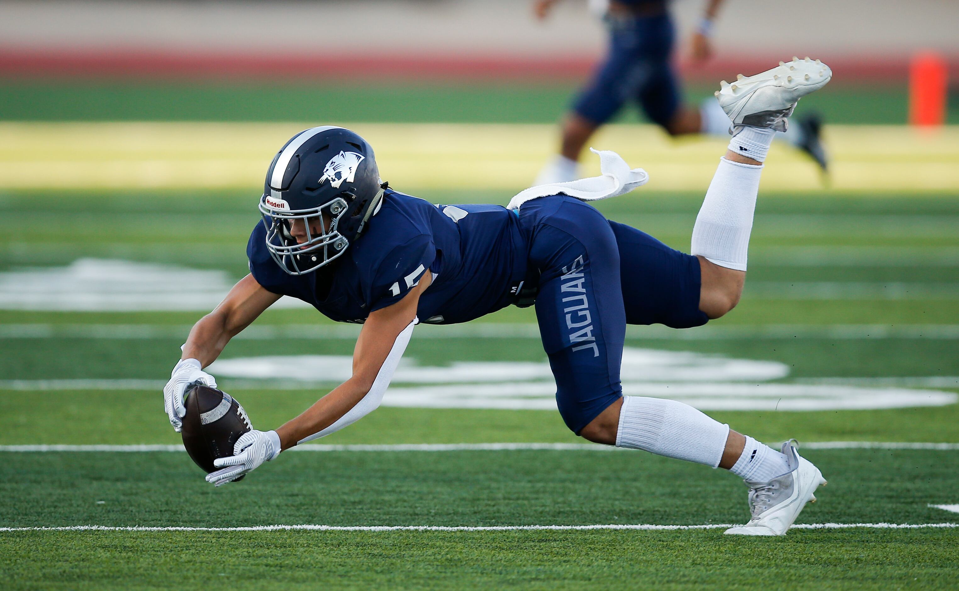 Flower Mound junior wide receiver Walker Mulkey (15) catches a pass during the first half of...