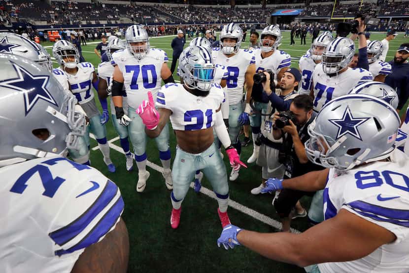 Dallas Cowboys running back Ezekiel Elliott (21) gets his teammates fired up before facing...