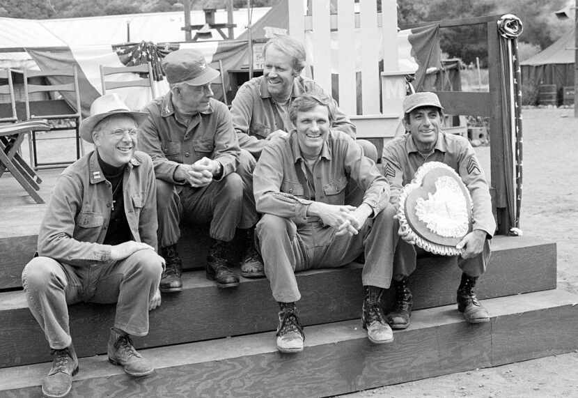  Cast members of the television series "M*A*S*H" take a break on the set during taping in...