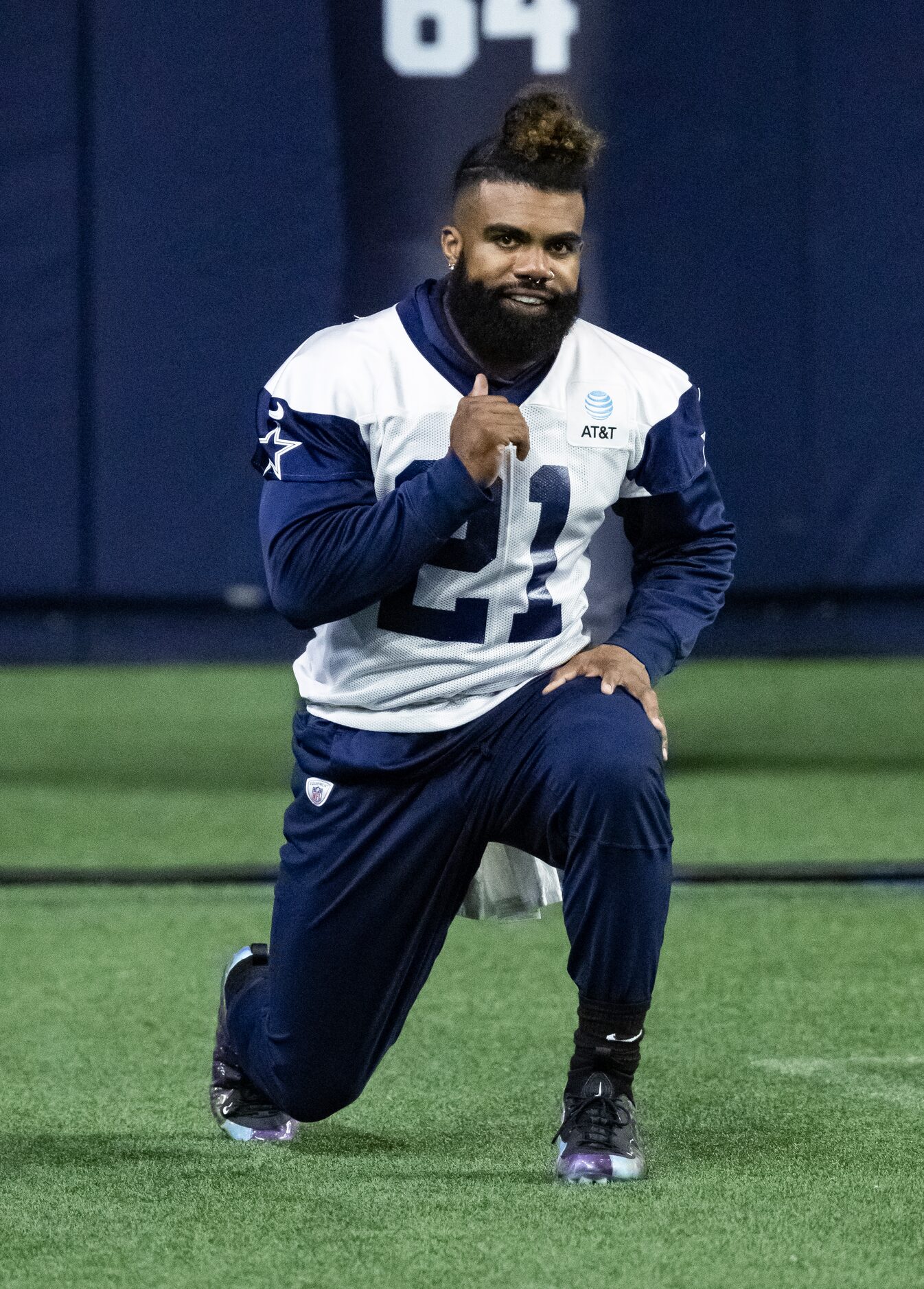 Dallas Cowboys running back Ezekiel Elliott stretches during practice at The Star in Frisco,...