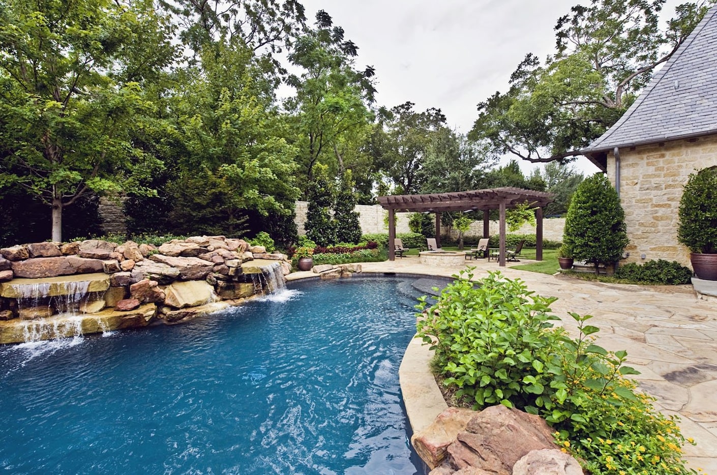 Check out the rock waterfalls on this pool.