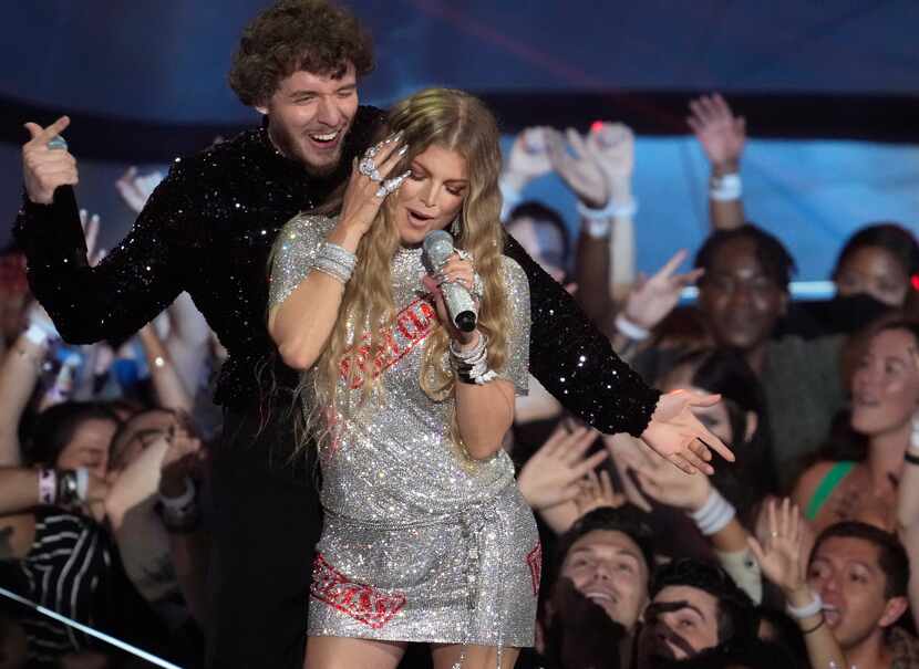 Jack Harlow, background, and Fergie perform "First Class" at the MTV Video Music Awards at...