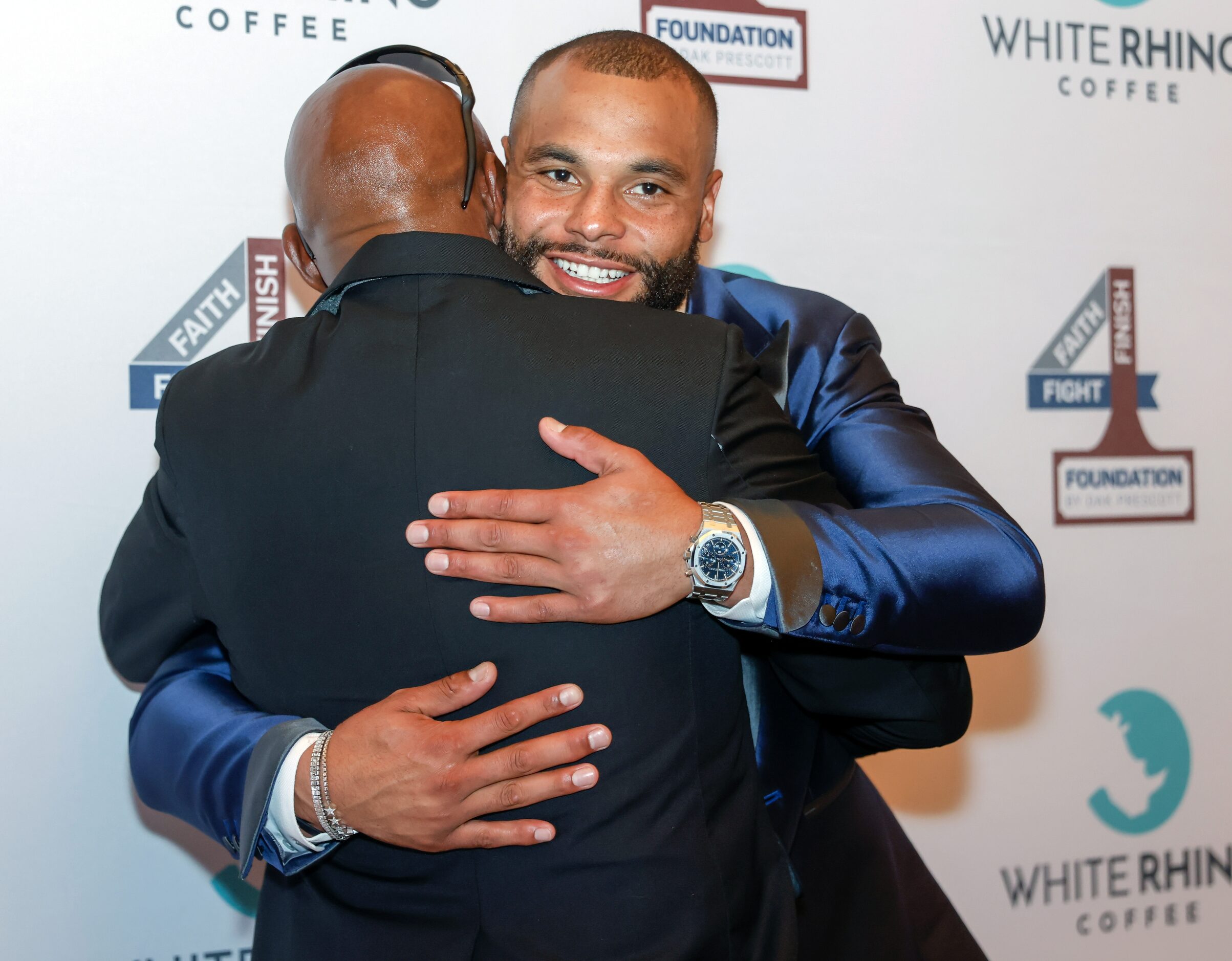 Nathaniel Prescott (left) embraces Dallas Cowboys quarterback Dak Prescott (right) after...