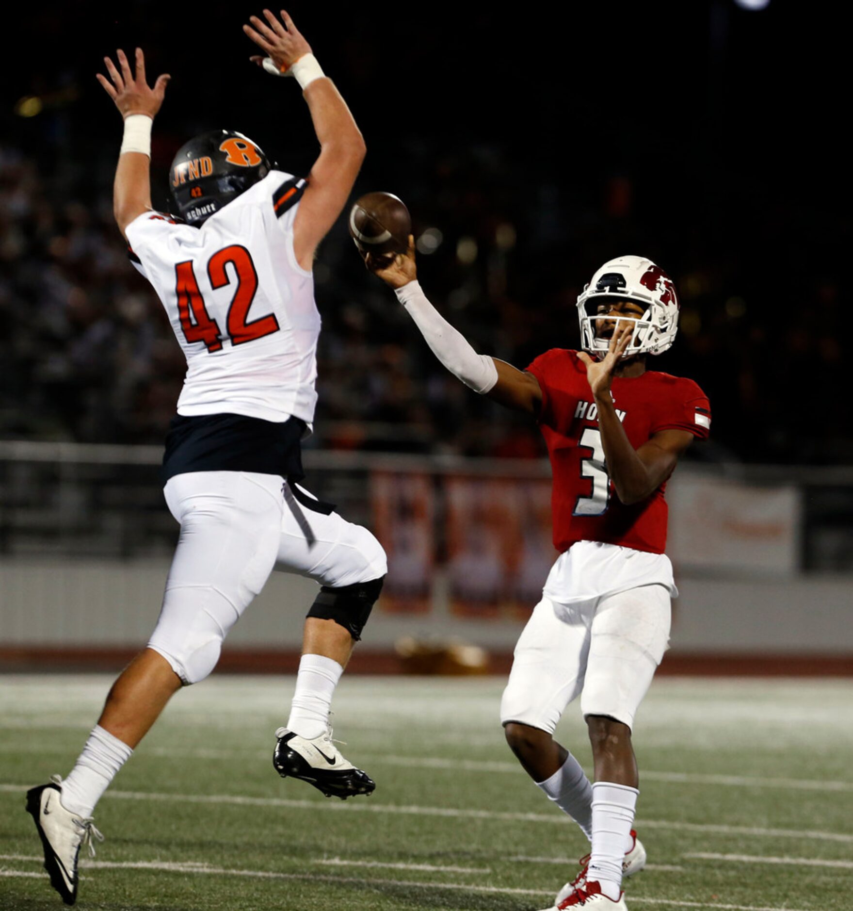 Rockwell defender Ben McCrillis (42) pressures Mesquite Horn QB Jermaine Givens (3) and...