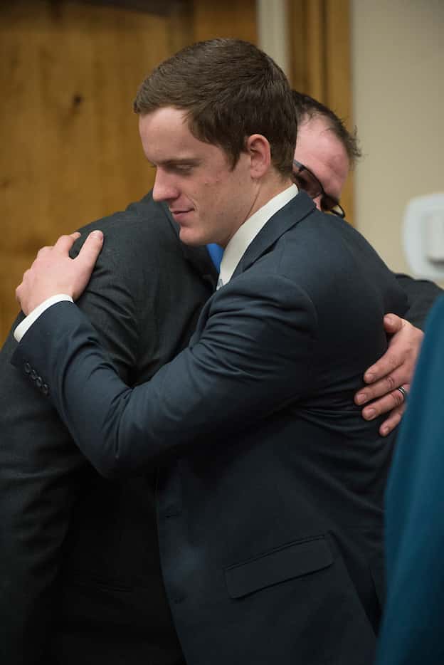 John R.K. Howard embraces defense attorney Ira Dillman after his sentencing hearing Friday....