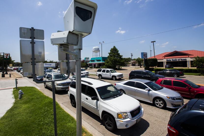 A red light camera at the intersection of Belt Line Road and southbound Highway 75 in...