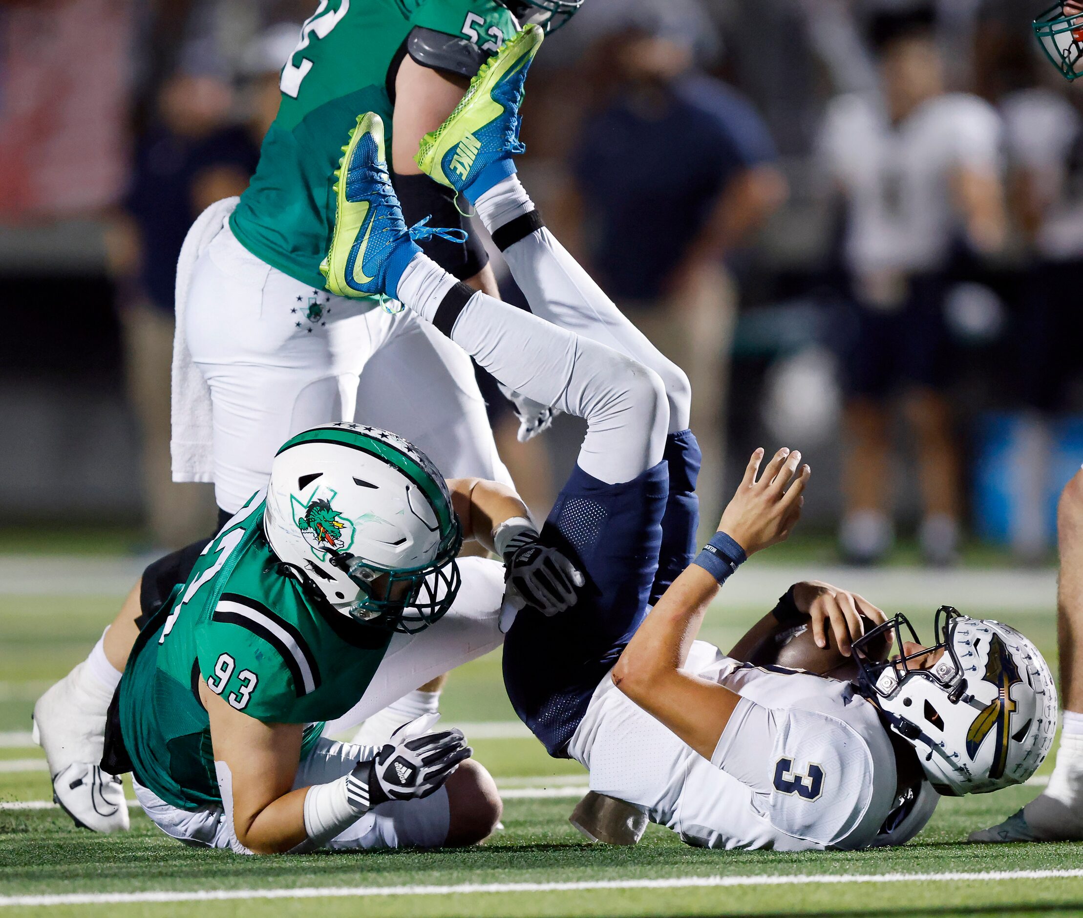 Southlake Carroll lineman Zach Scarborough (93) sacks Keller quarterback Tre Guerra (3)...