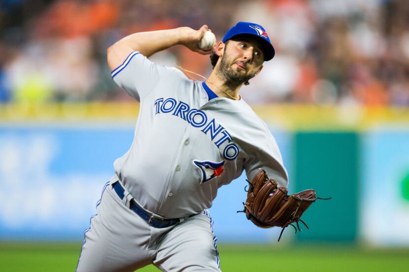 Toronto Blue Jays starting pitcher Mike Bolsinger (49) delivers the pitch in the fourth...