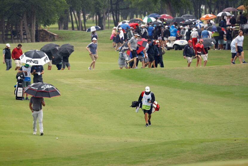 Scott Stallings makes his way up the fairway as it rains on the 9th hole during round 4 of...