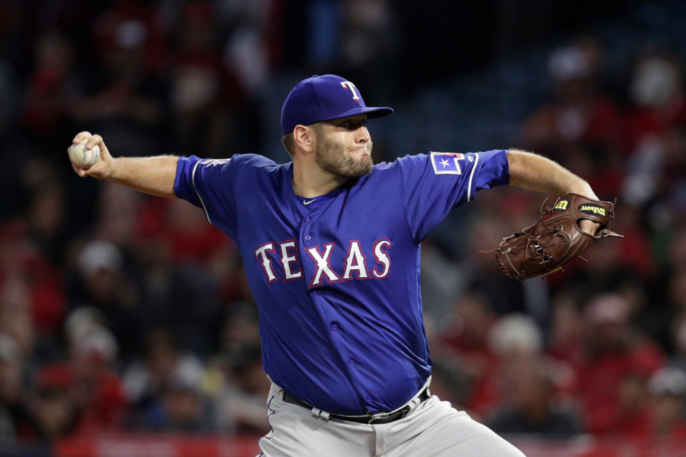 Texas Rangers starting pitcher Lance Lynn throws to aLos Angeles Angels batter during the...